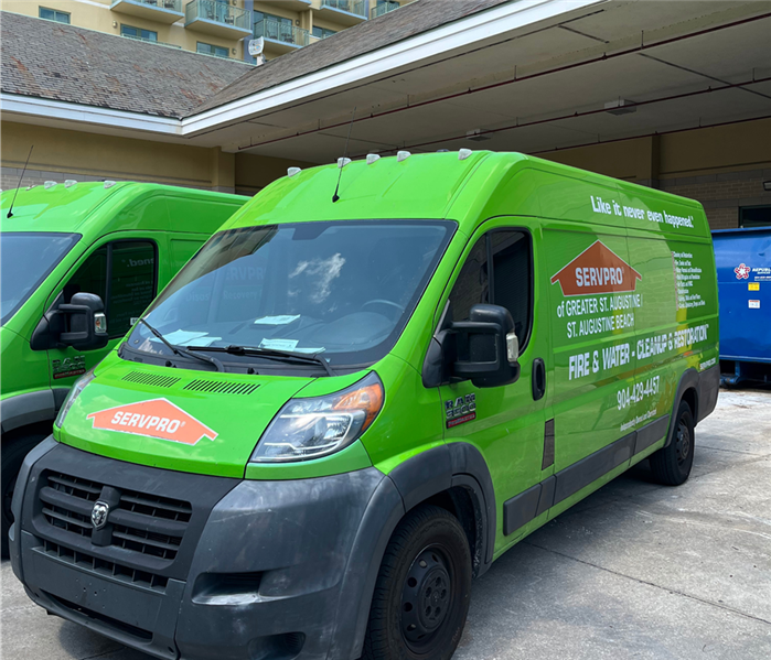 servpro vehicles outside a hotel responding to water damage