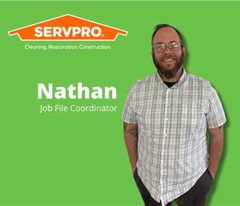 male servpro job file coordinator with green background and servpro logo