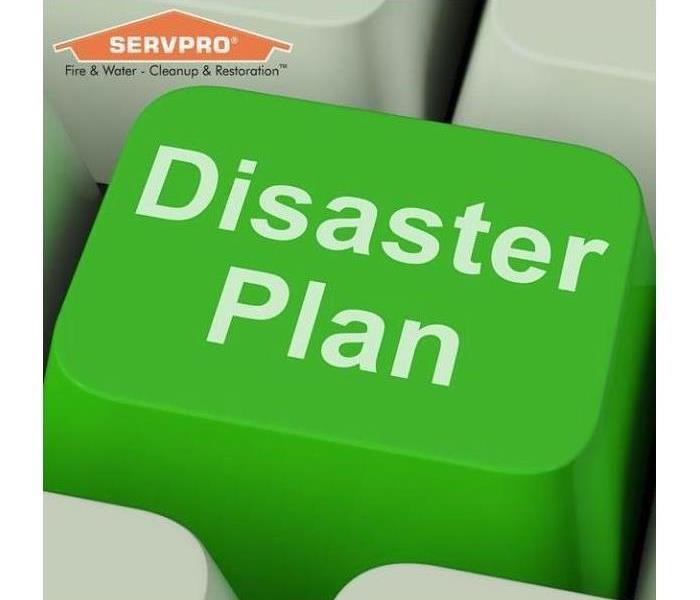 Green key on keyboard that says disaster plan with a SERVPRO logo